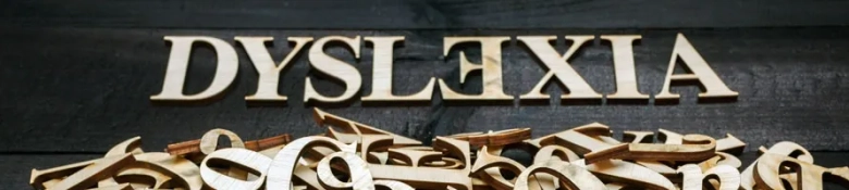 Dyslexia spelt out in gold letters.