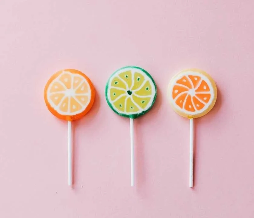 Three differently coloured lollipops 