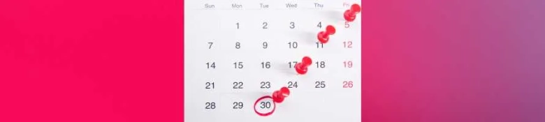 A month's calendar with red pins in individual days, set against a pink and purple background