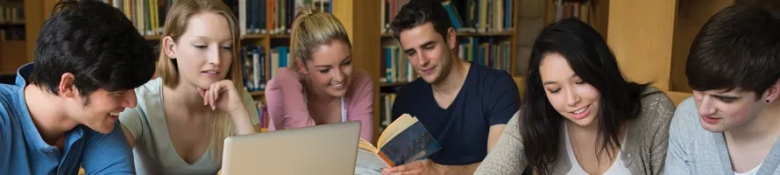 The image shows a group of postgraduate students studying together