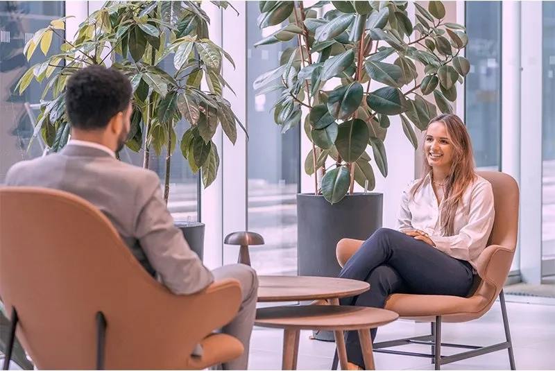 woman and man speaking to each other