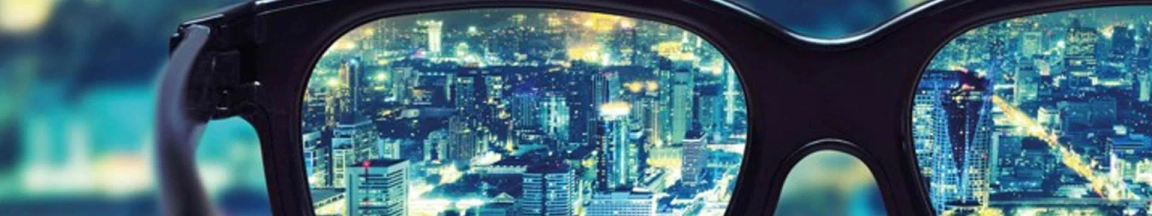 View of city skyline through glasses