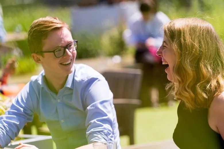Two people laughing