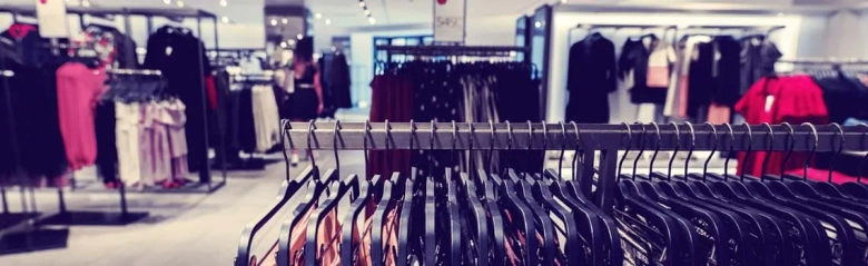 Clothes rails on a shop floor: retail buyers identify, select and purchase stock for retailers