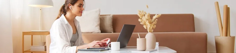 a woman sitting at her computer applying for a job. 