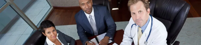 Graduate doctors sitting at a desk