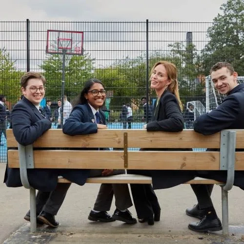 4 people sat on a bench