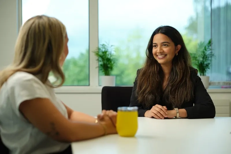 Two female employees having a conversation
