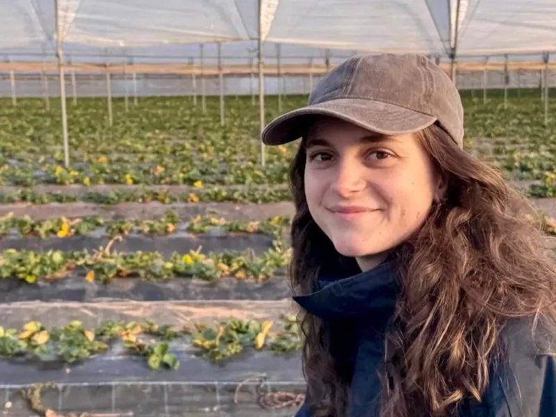 Ariana posing in a farm