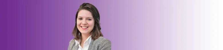 Smiling woman in business attire with a purple background, representing a new hire at Arthur D. Little.