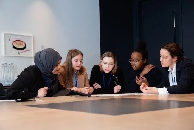 A group of women sitting around a table