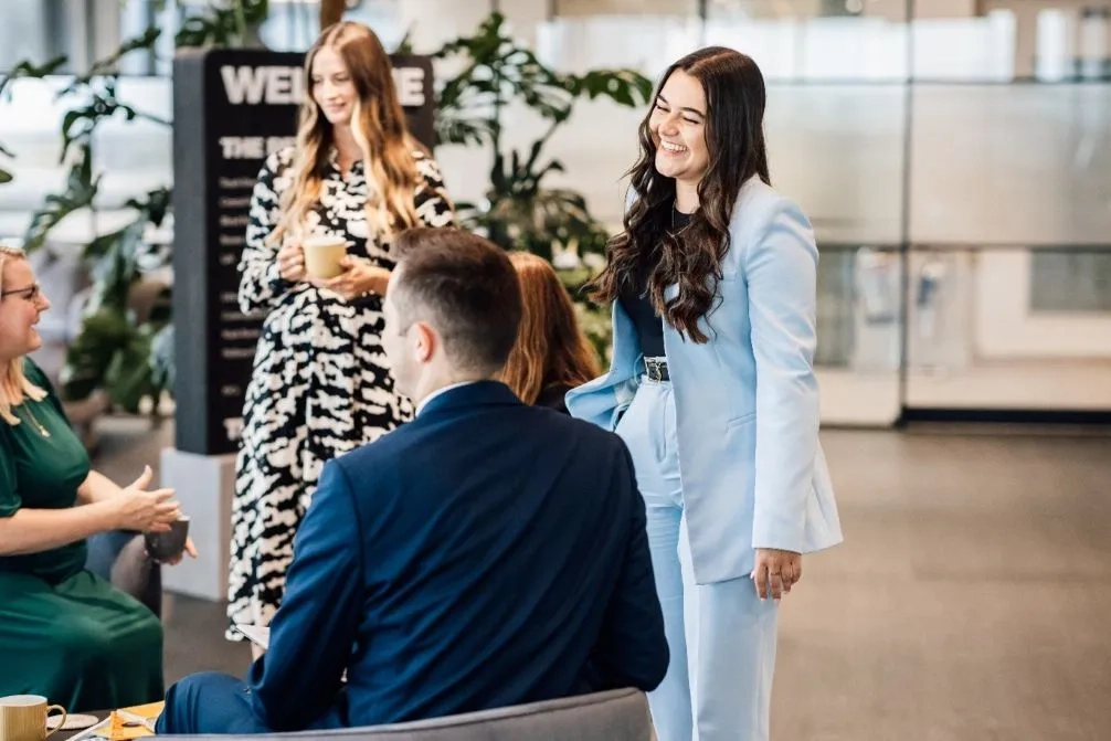 Shoosmiths trainees sitting and chatting 