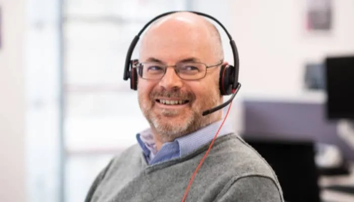 Man smiling with headset on