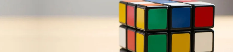 Unsolved Rubik's Cube on a table, symbolizing problem-solving in technical interviews.