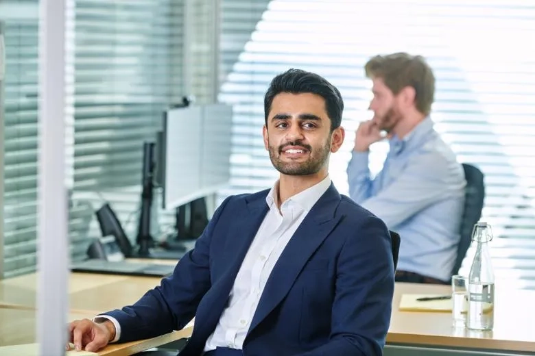 A man smiling at work 