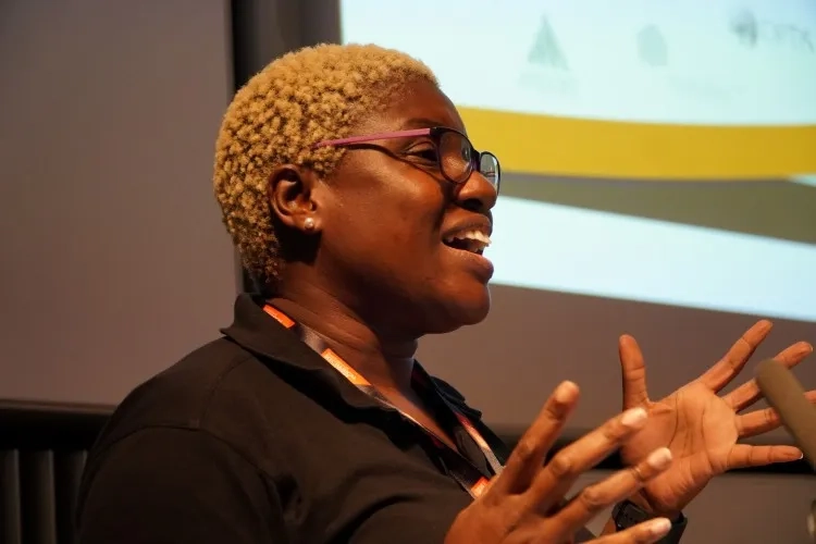 A female speaking in front