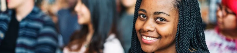 A student smiling at the camera. 