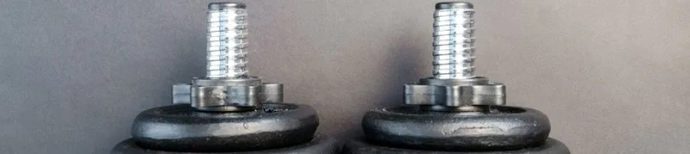 A pair of grey dumbbells.