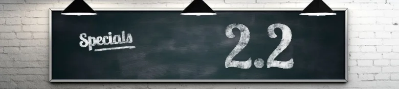 A blackboard with the word 'special' and number '2.2' written on it in white chalk.