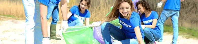 A group of university student volunteers picking up rubbish