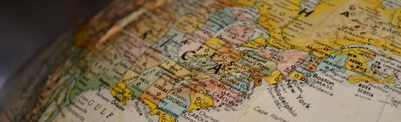 Close-up of a globe focusing on the eastern coast of the United States.