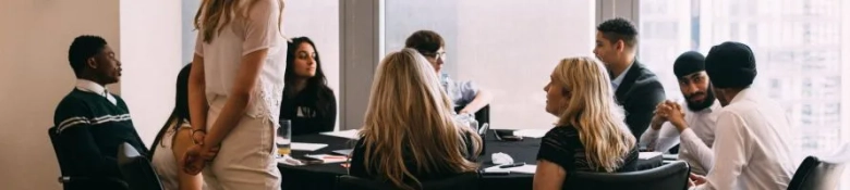 A group of SPARK interns sat around a table at Clifford Chance's offices