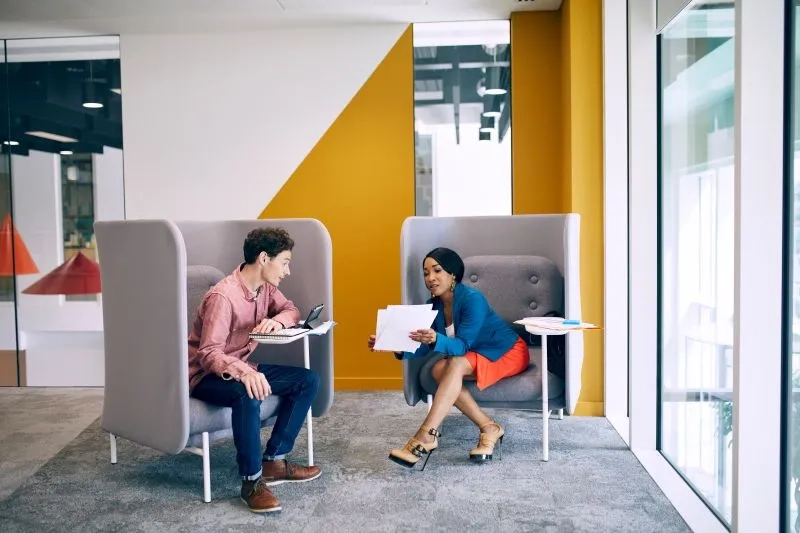 Two employees talking to each other