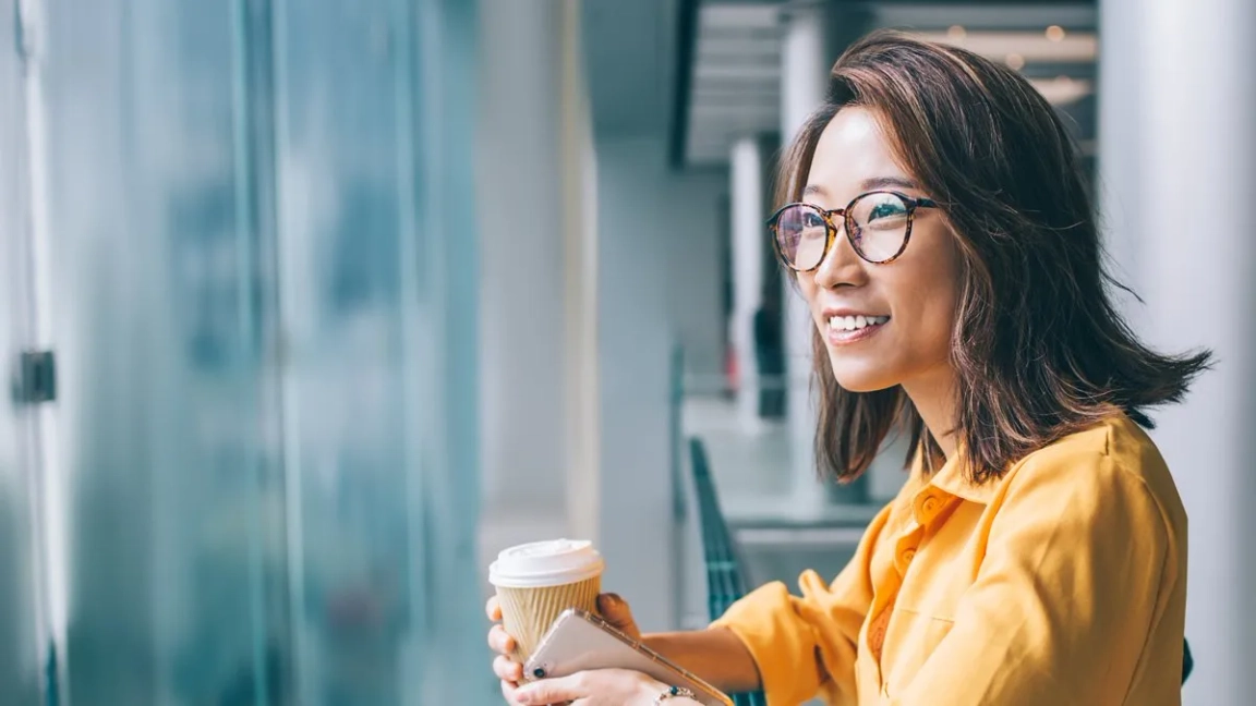 woman smiling by window