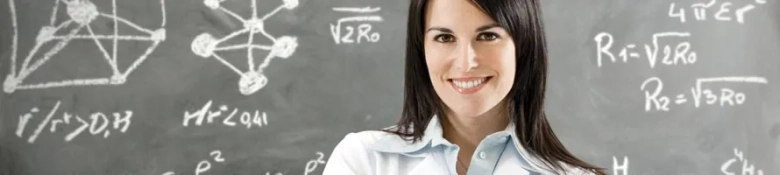 Confident woman standing in front of a blackboard with mathematical equations.