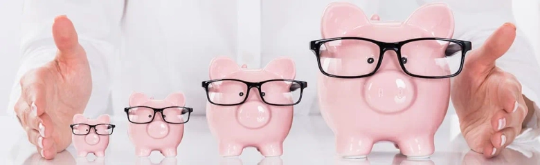 Four fund-manager-esque piggy banks with glasses on
