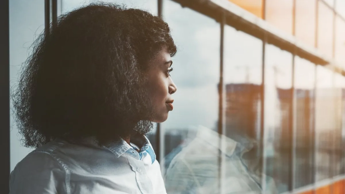 woman looking outside the window