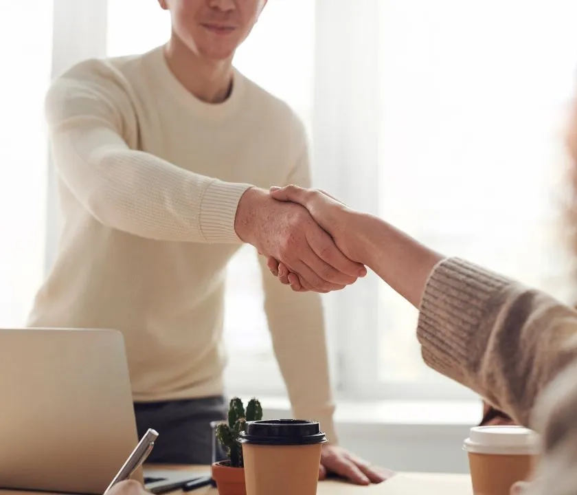 Two people shaking hands. 