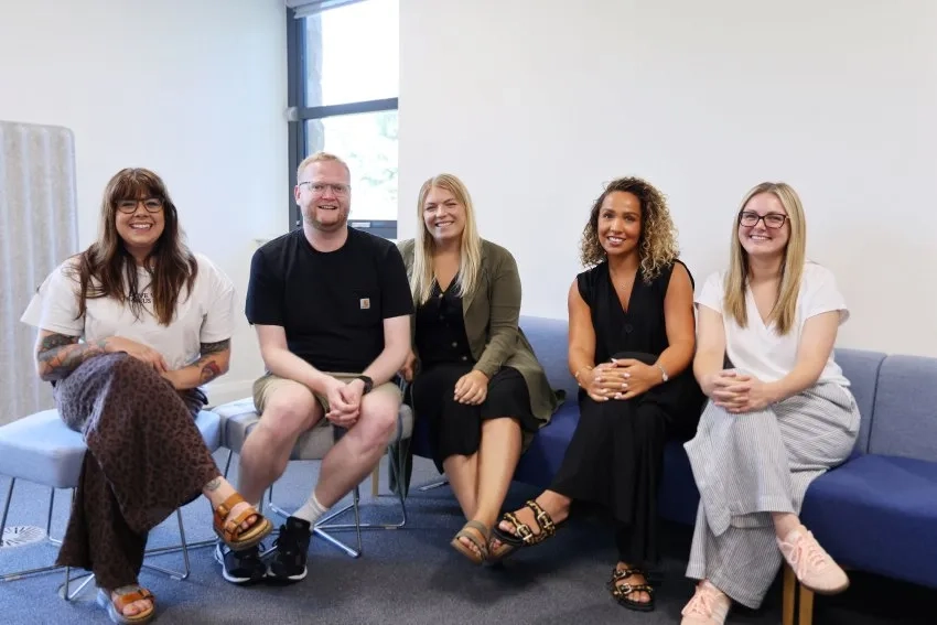 Group of employees smiling at the camera