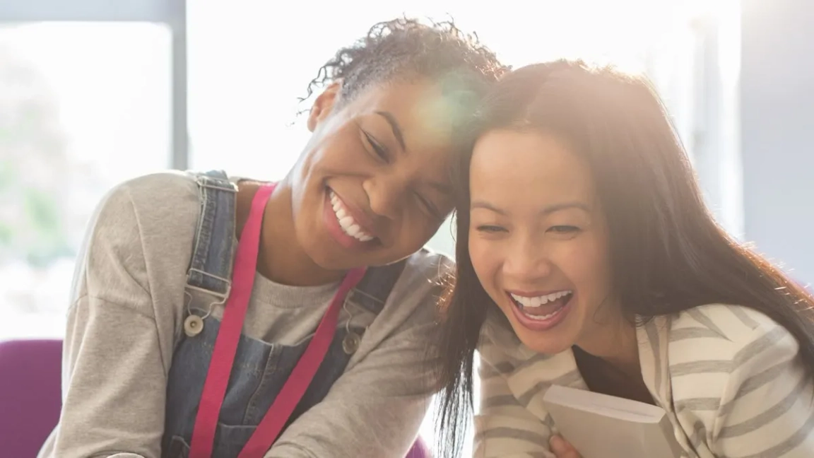 two woman smiling
