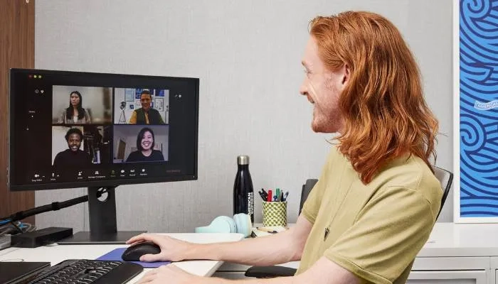 Man on a Zoom call sitting at desk