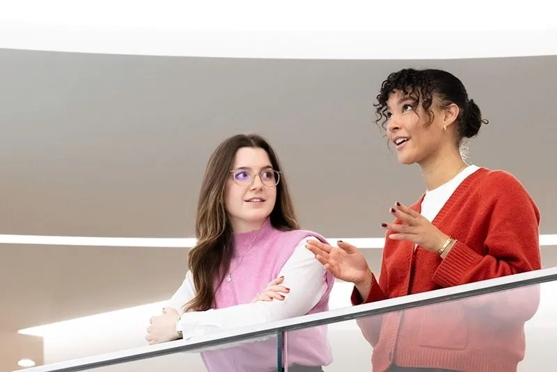 two trainee women chatting