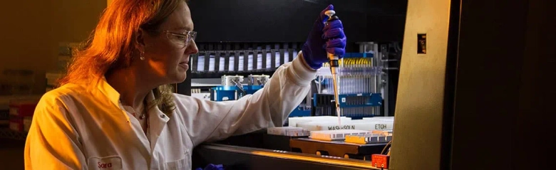 Forensic scientist working in a lab