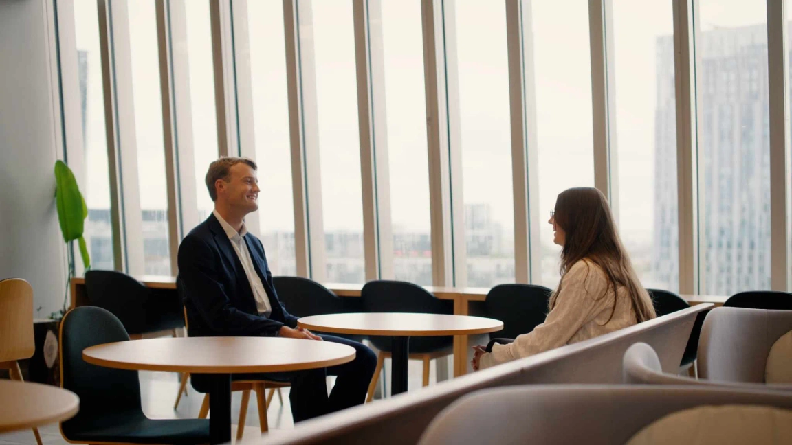 man and woman speaking to each other
