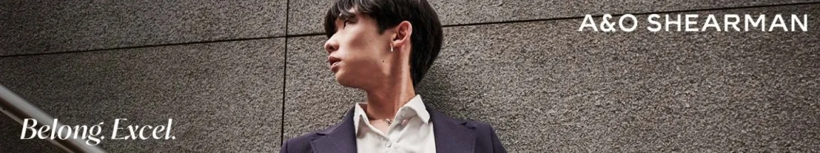 male trainee looking away with A&O Shearman logo