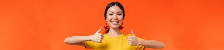 A woman with two thumbs up, signifying she is on track for a great career