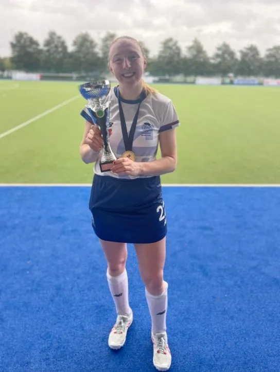 Emily holding a trophy