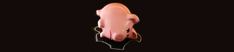 An unpaid intern’s empty piggy bank lying on its side looking tired. 