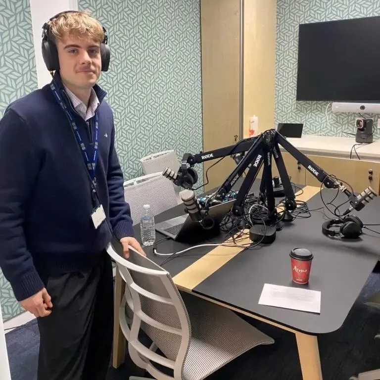 George learning how the new podcasting equipment works
