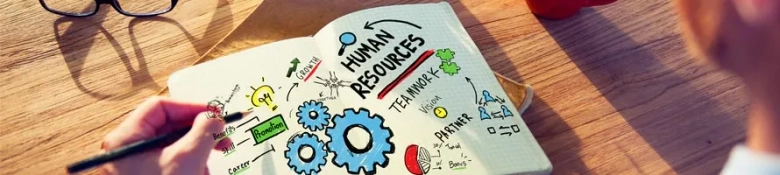 Notebook with words including 'human resources', 'teamwork' and 'promotion': HR graduate schemes
