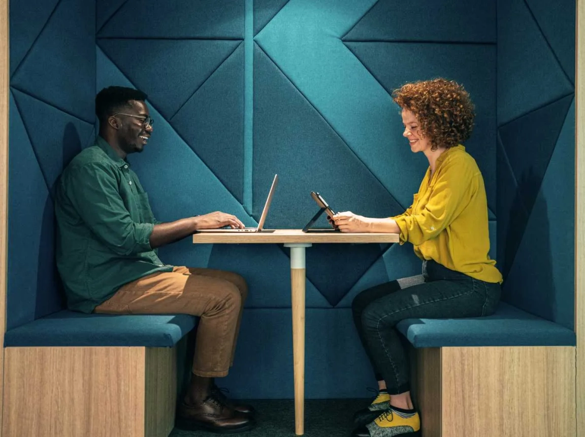 man and woman in meeting