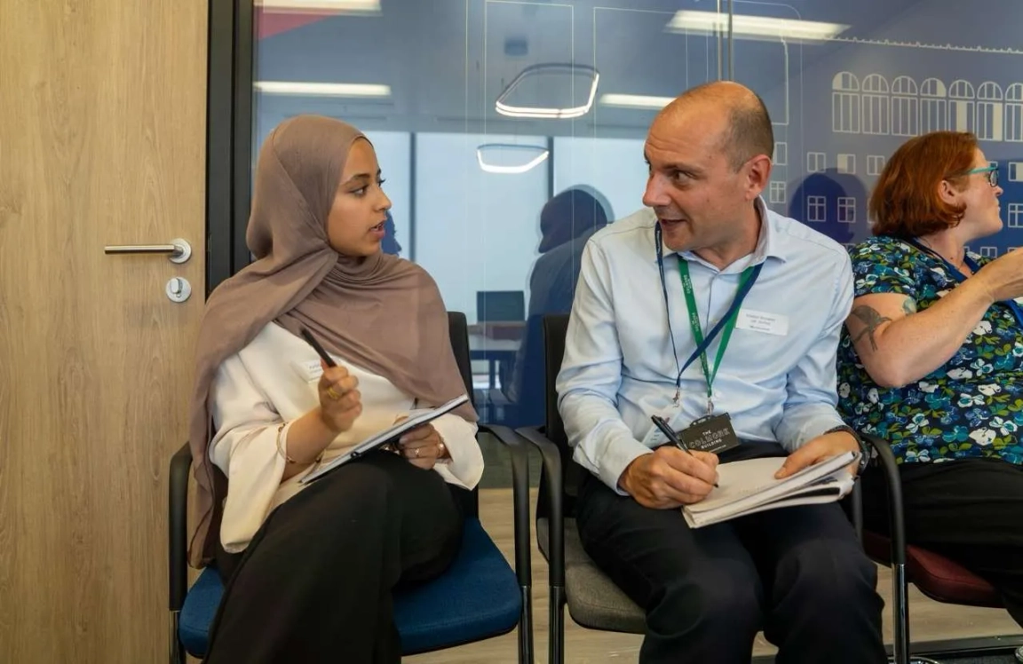 Irwin Mitchell two individuals speaking