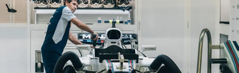 Automotive engineer working on a racing car.