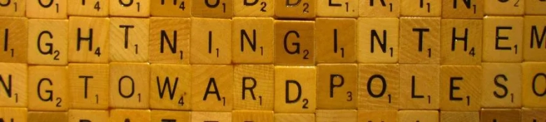 Wooden blocks with letters spelling out "writing in them" related to crafting applications.