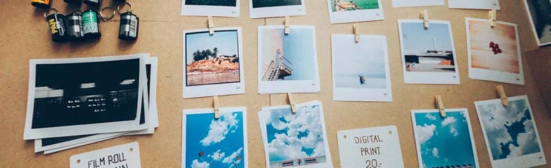 A picture of a pin board covered in colourful photos