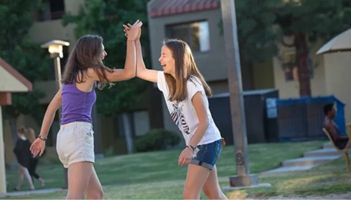 Two girls high fiving